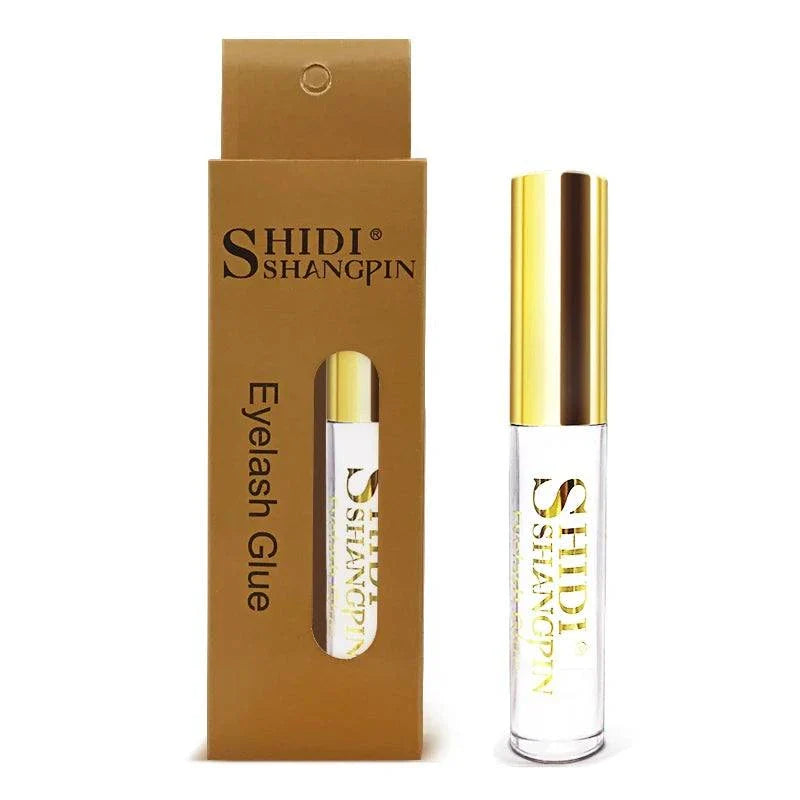 glitter eyeshadow palette keyword does not match the image showing eyelash glue in gold and clear packaging