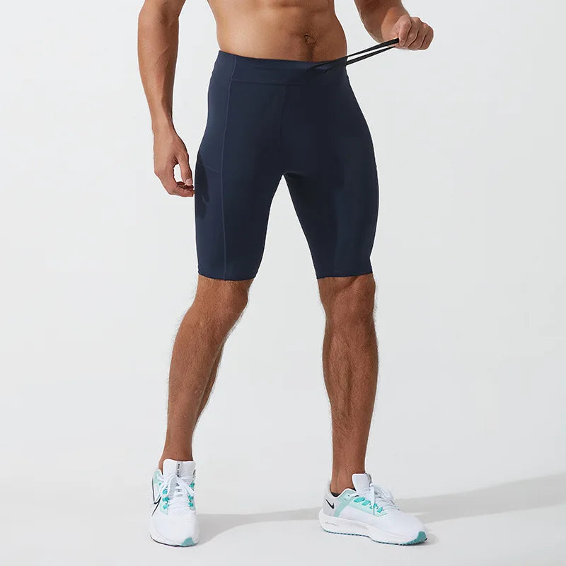 Men's compression shorts in navy blue with elastic waistband for athletic performance and quick-dry fabric