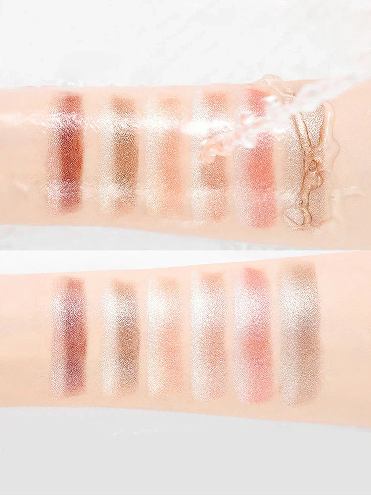 swatches of Gradient Two-Color Eye Shadow Pen showing pearlescent shimmer and waterproof formula on skin