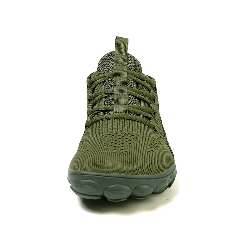 Front view of green new hiking shoes with breathable mesh and flexible sole for outdoor and indoor use
