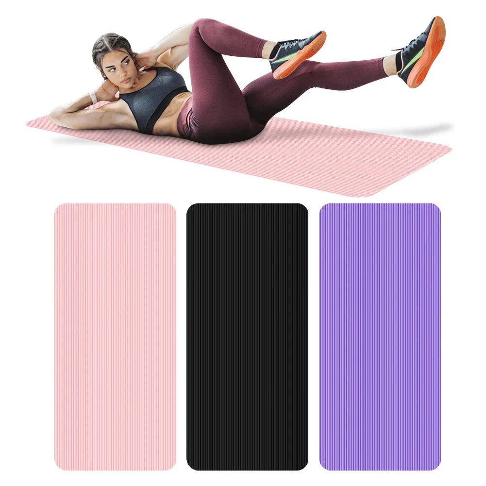 Woman exercising on pink non-slip yoga mat with additional pink, black, and purple textured yoga mats displayed below