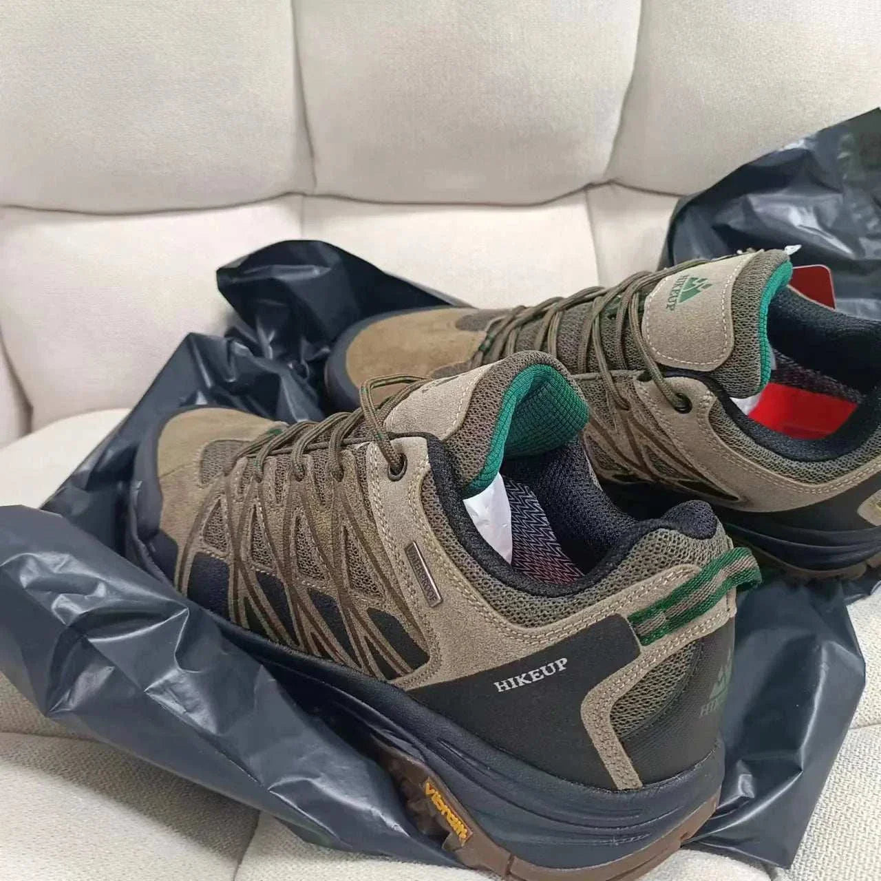 HIKEUP men's hiking shoes in brown and green with durable construction, breathable mesh, and high-traction soles for all-terrain outdoor use.