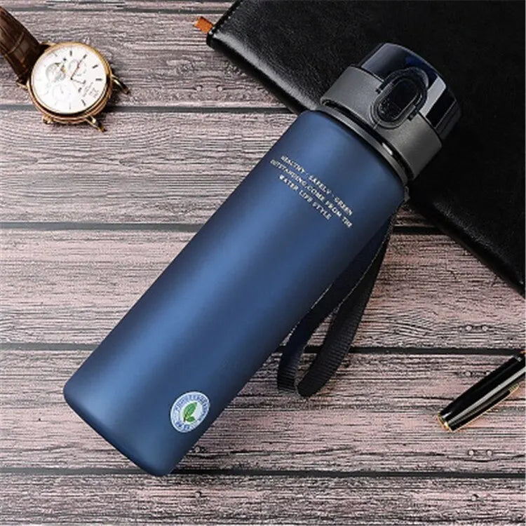 BPA-Free leak-proof navy blue sports water bottle with secure lid and portable design for hiking and fitness