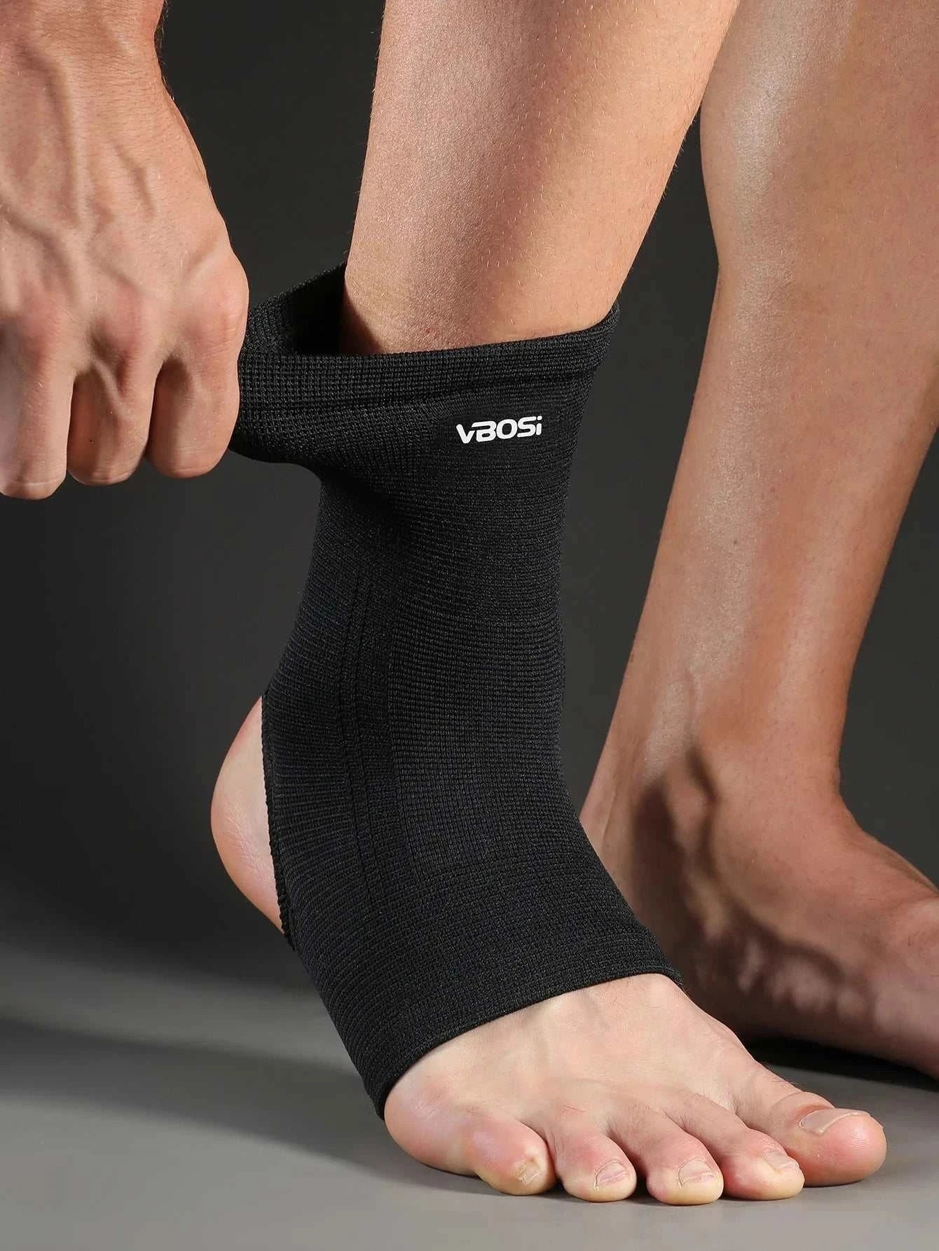 Elastic breathable ankle support brace in black, stretchy fabric providing compression and comfort for sports and daily wear