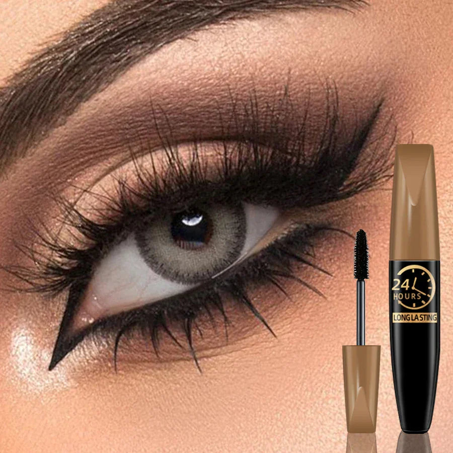 Close-up of eye with dramatic lashes using 5D Black Silk Fiber Mascara, waterproof and volumizing black mascara tube with wand shown.