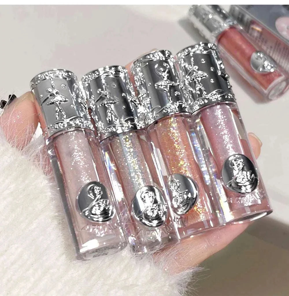 Balletism liquid eyeshadow with delicate fine shimmer in elegant silver-capped tubes held in hand