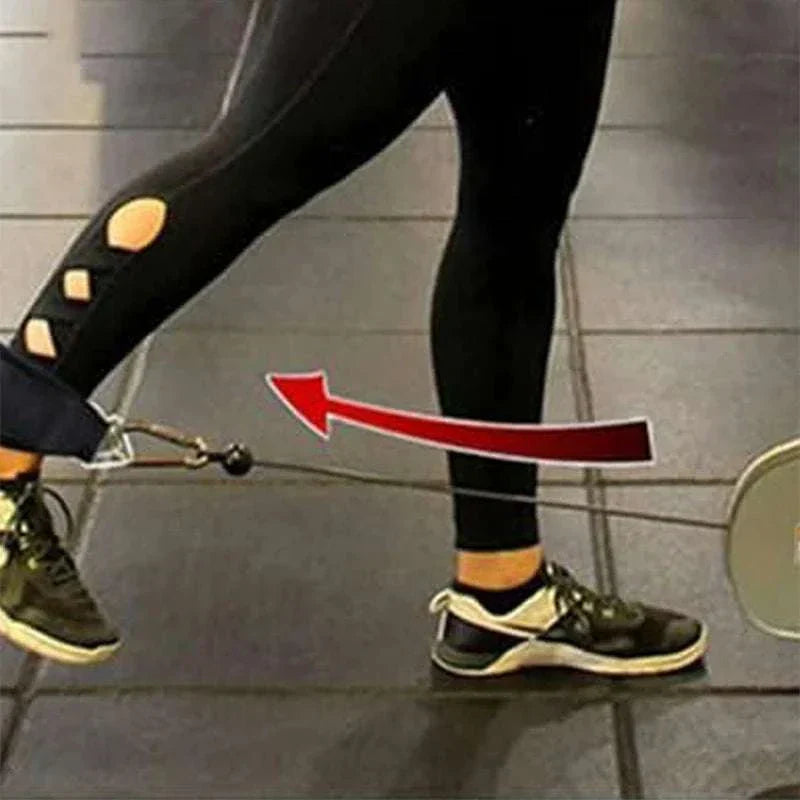 Pair of adjustable ankle straps with double D-rings used for resistance training attached to cable machine