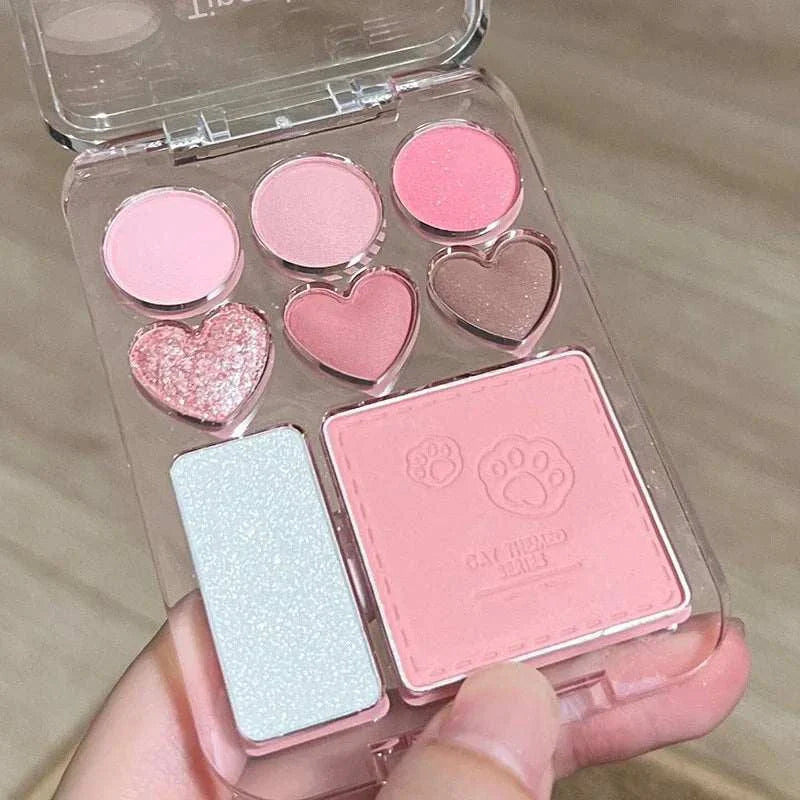 Compact 8-color pink and orange eyeshadow palette with heart-shaped pans and highlighter for versatile makeup looks
