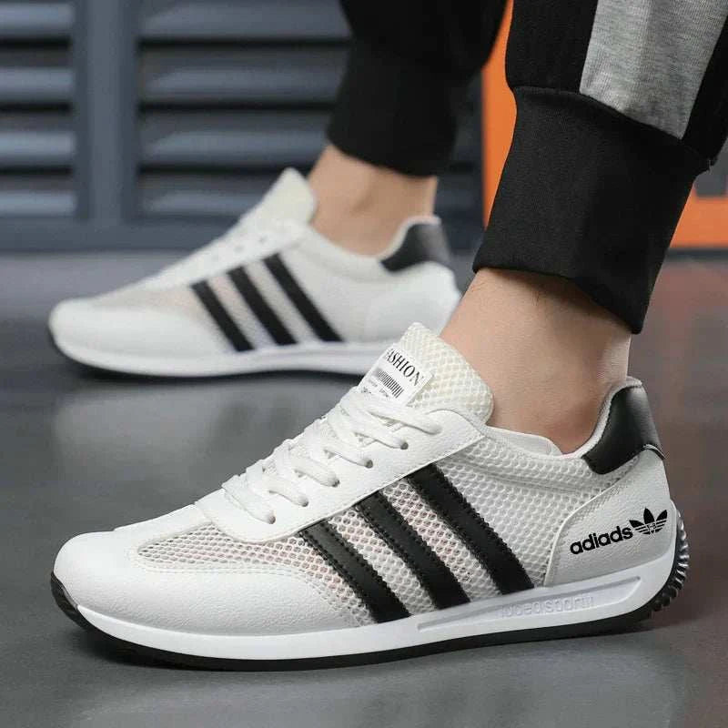 White men's casual sport shoes with breathable mesh upper and black stripes, lightweight and flexible design for running and everyday wear