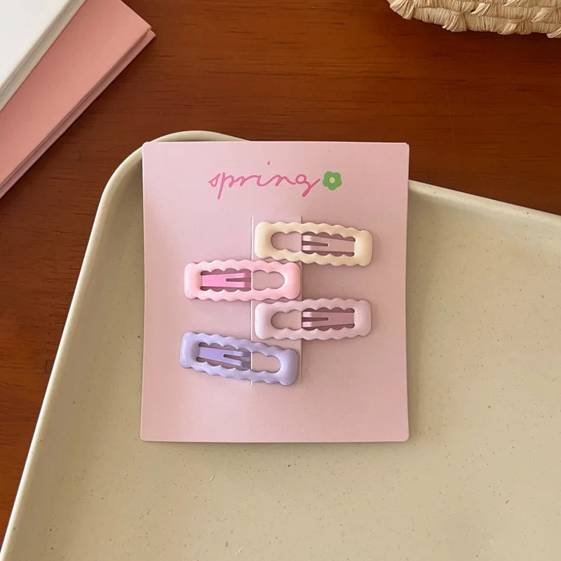 4pcs set cute colorful geometric mini hair clips in pastel pink purple and cream on card