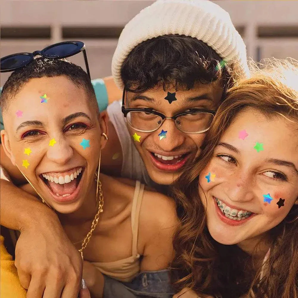 Three happy young people with colorful star pimple patches on their faces outdoors, showcasing playful acne care stickers