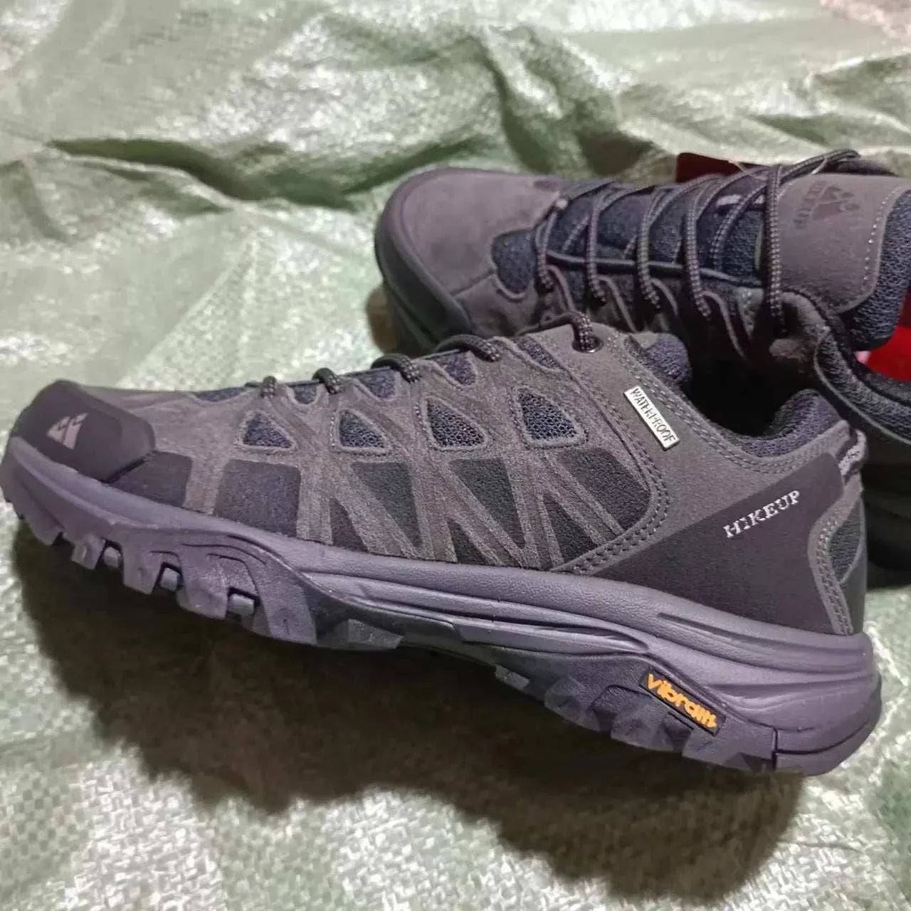 HIKEUP men's hiking shoes in dark gray with durable construction, superior grip Vibram soles, breathable mesh, and all-terrain design for outdoor adventures