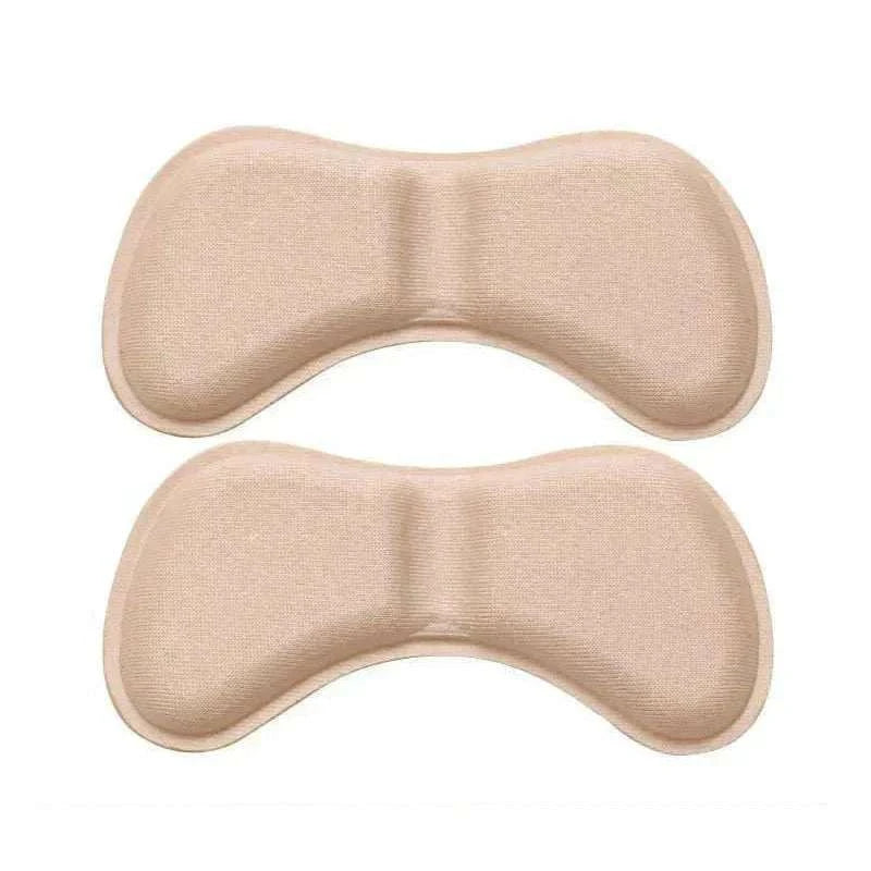 Beige heel insoles patch with cushioned support and self-adhesive backing for pain relief and shoe protection.