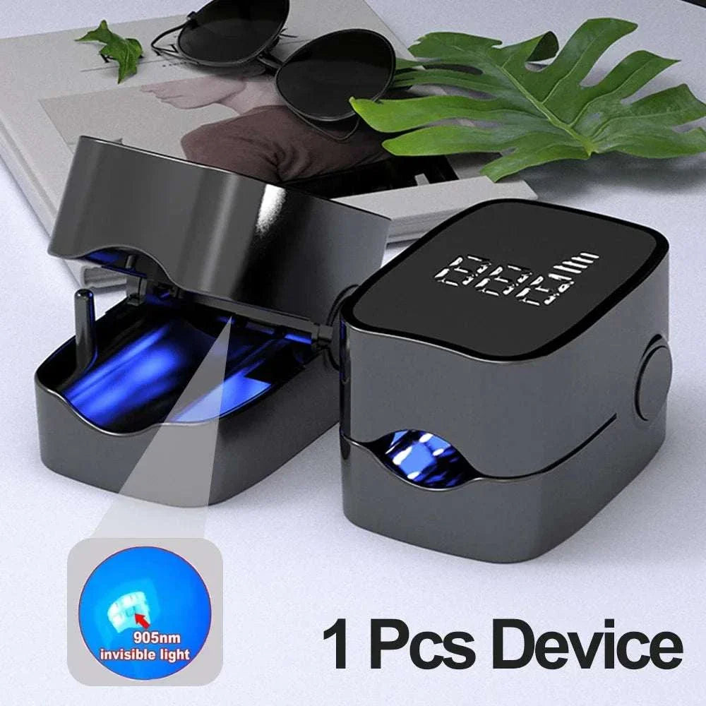 Compact black nail care device with UV light for fungal treatment and nail repair displayed on a flat surface with sunglasses and greenery.