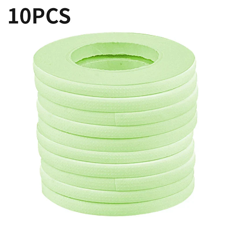 Stack of 10 rolls of gentle breathable micropore eyelash extension tape for securing lower lashes during application