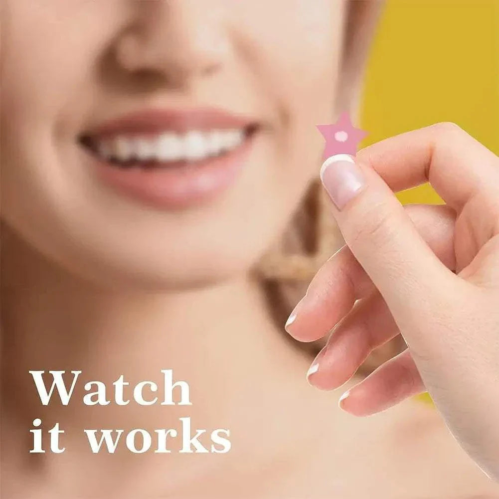 Close-up of a hand holding a pink colorful star-shaped pimple patch with a smiling person blurred in the background and text "Watch it works"