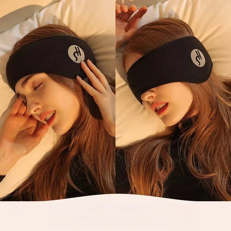 Woman wearing adjustable black sleep eye mask with noise-reducing earplugs for restful sleep