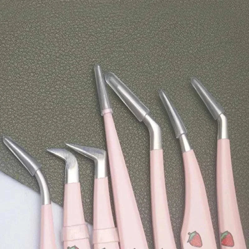 Set of six precision false eyelash tweezers in pink with various angled tips for professional lash application and removal