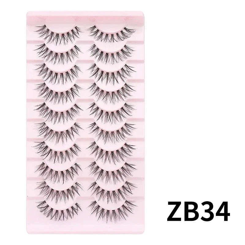 10 pairs of Natural Manga full strip false eyelashes with bold, voluminous, anime-inspired design on light pink tray, style ZB34