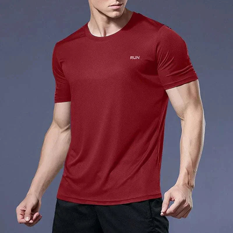 Men’s red quick-dry compression sport t-shirt with short sleeves designed for fitness and training.