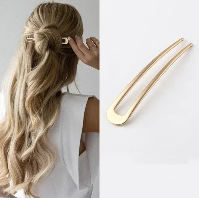 Elegant Pearl U-Shaped Hairpin in gold metal securing half-up hairstyle with long blonde waves