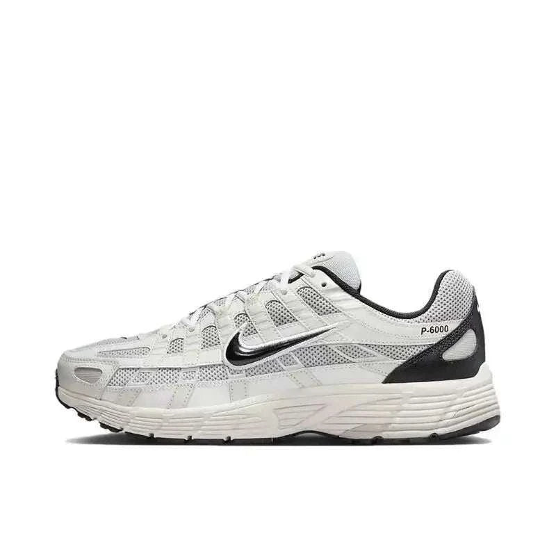 Side view of Nike P-6000 Unisex casual running sneaker in white with black and metallic silver accents