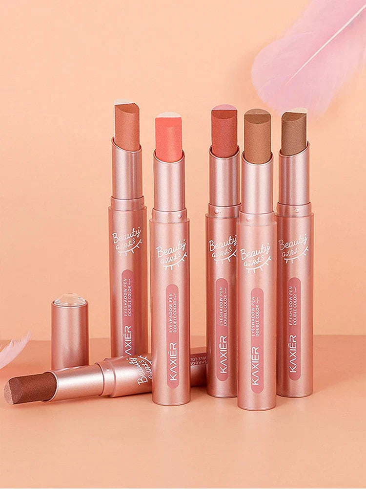 Gradient Two-Color Eye Shadow Pen collection with dual-tone, shimmery shades in sleek rose gold tubes on peach background