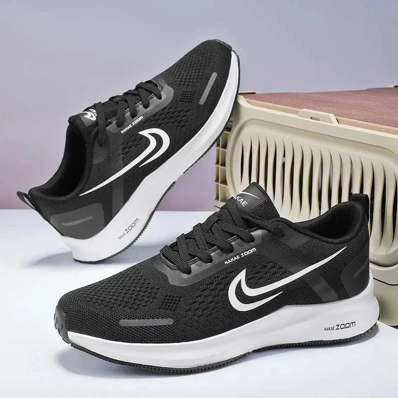 Black men's lightweight running shoes with breathable mesh and white sole, designed for athletic and sports performance