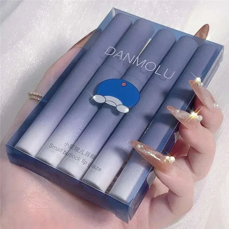 Matte Lipstick Set of 5 vibrant colors in sleek blue packaging held in hand with manicured nails