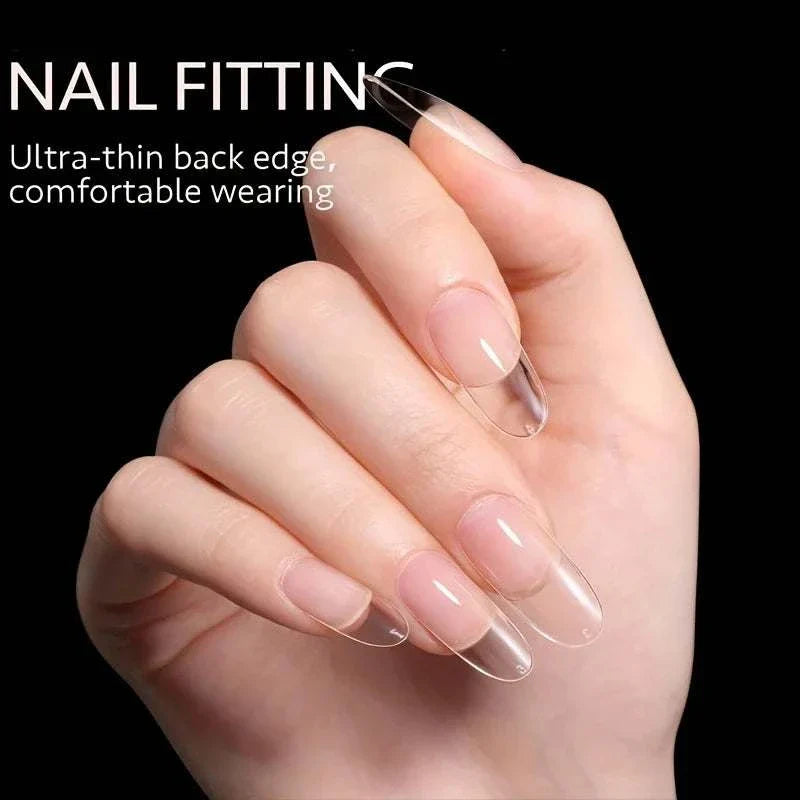 Hand with clear full cover press-on nail tips showing ultra-thin back edge for comfortable wearing