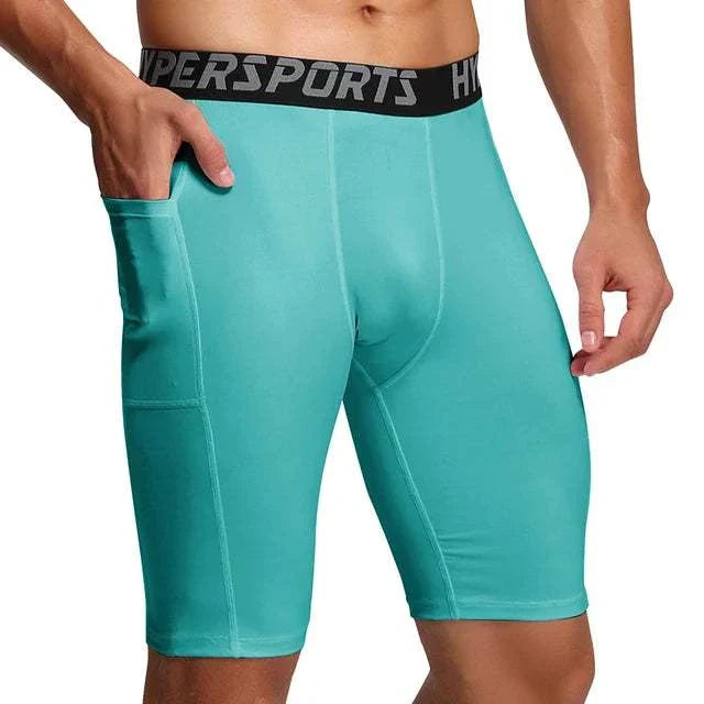 Men’s compression shorts in turquoise with black branded waistband and side pocket, designed for breathable, flexible sportswear and gym training.
