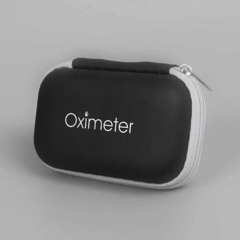 Compact black and gray carrying case for oximeter with zipper closure