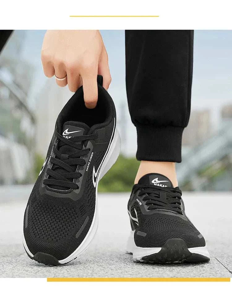 Men's black lightweight running shoes with breathable mesh, white sole, and sporty design for athletic use