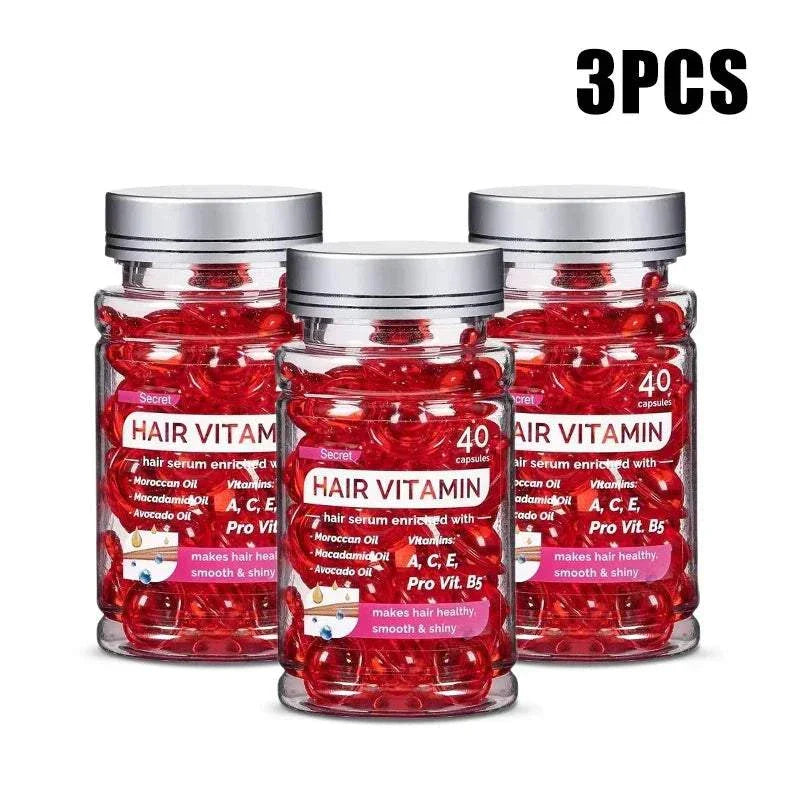 Three bottles of Moroccan Agam Vitamin Oil hair serum capsules with silver lids, containing 40 red capsules each for hair repair and shine.