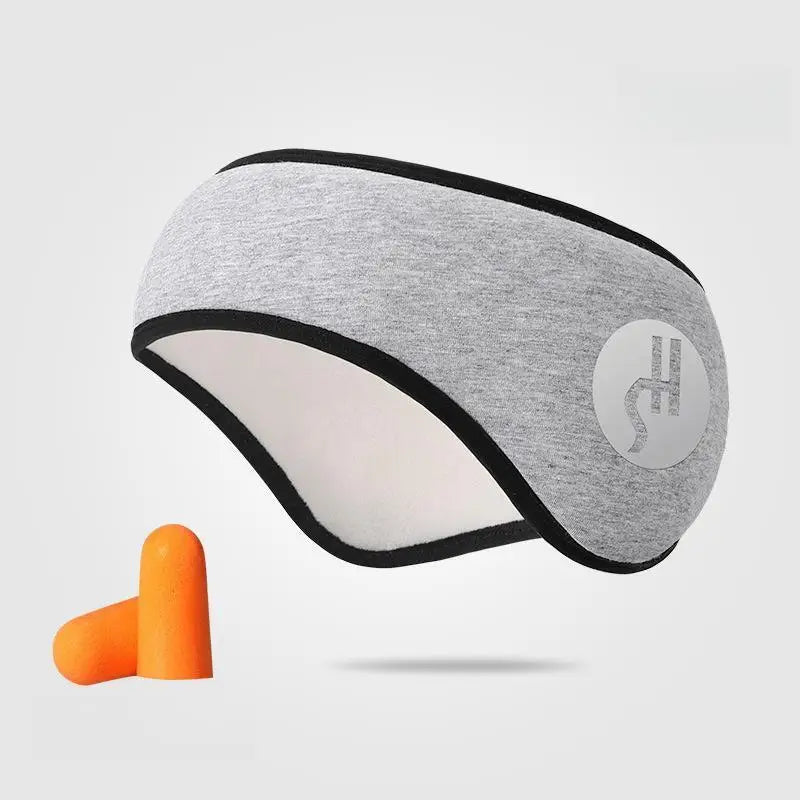 Adjustable gray sleep eye mask with black trim and orange noise-reducing earplugs for travel and rest