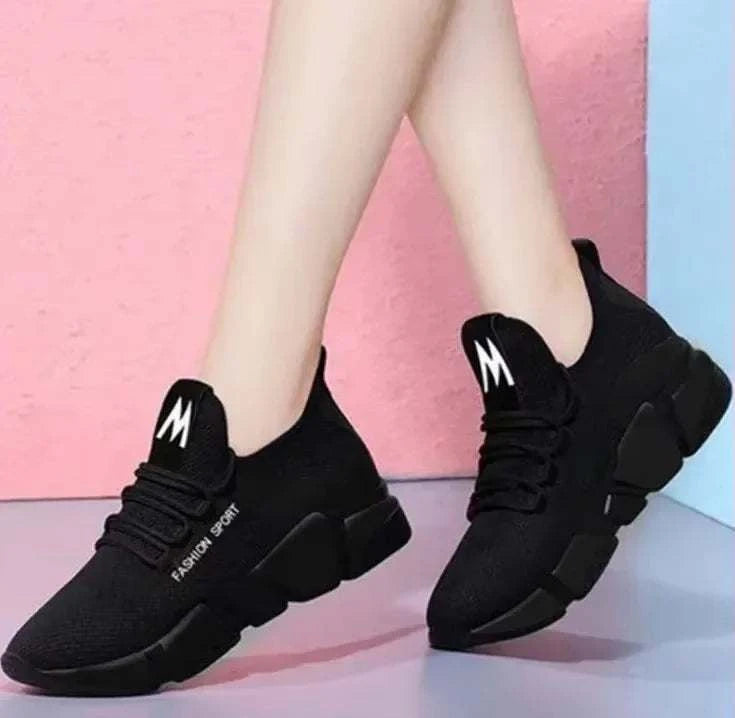 Stylish black women's shoes with lightweight, breathable material and durable sole for casual and sporty wear.