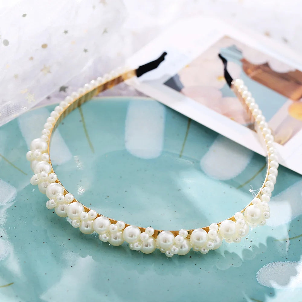 Modyle full pearl elastic hairband with floral pearl design on gold-tone band