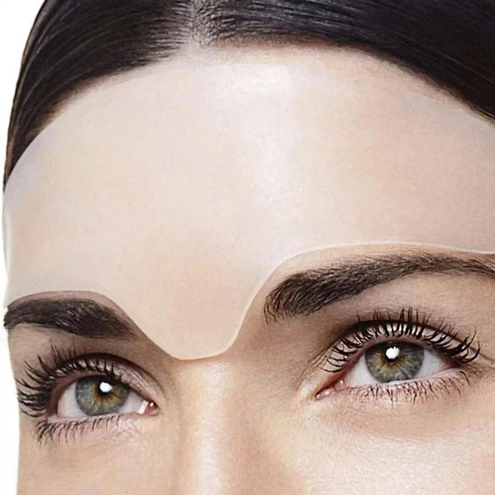Reusable anti-wrinkle silicone forehead patch applied on smooth skin to reduce fine lines and wrinkles