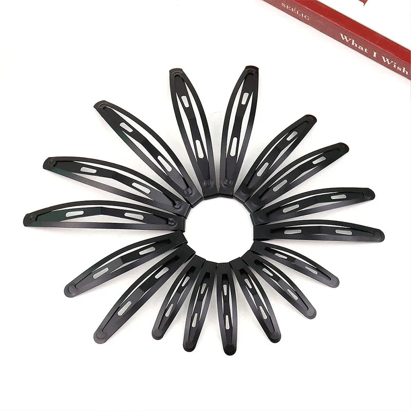 Set of 10 matte black frosted alloy snap hair clips arranged in a circle, durable and sleek design
