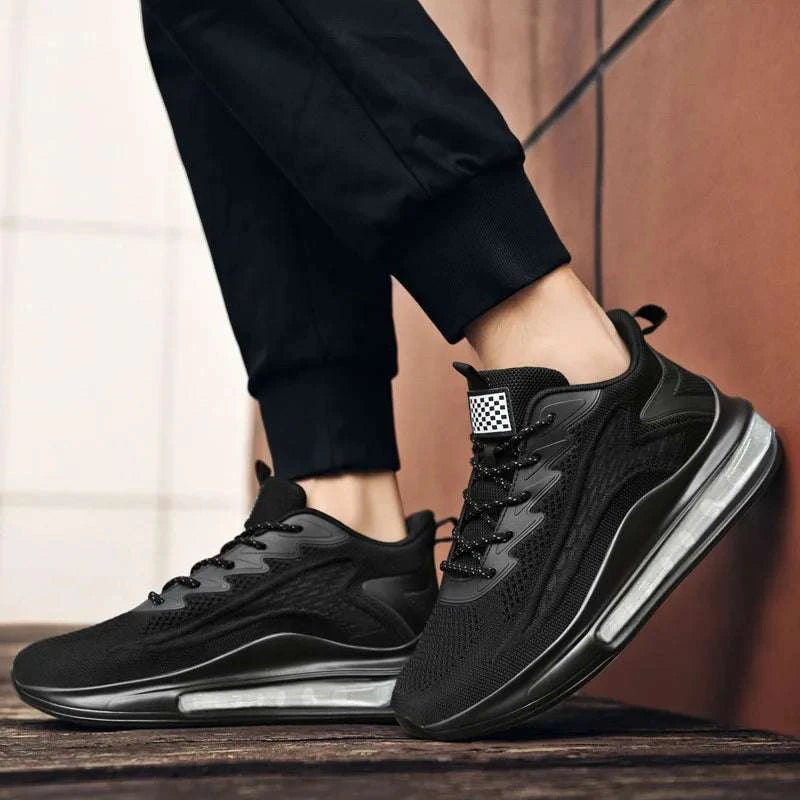 Breathable unisex sneaker in black with vulcanized rubber sole, lightweight mesh upper, and cushioned insole for all-day comfort.