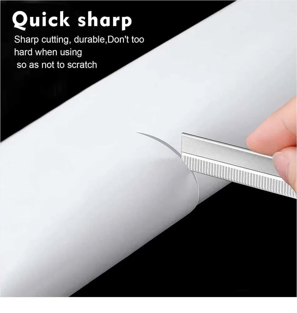Close-up of sharp, durable eyebrow trimmer blade cutting white paper for precise grooming, part of eyebrow pencil and trimmer set.
