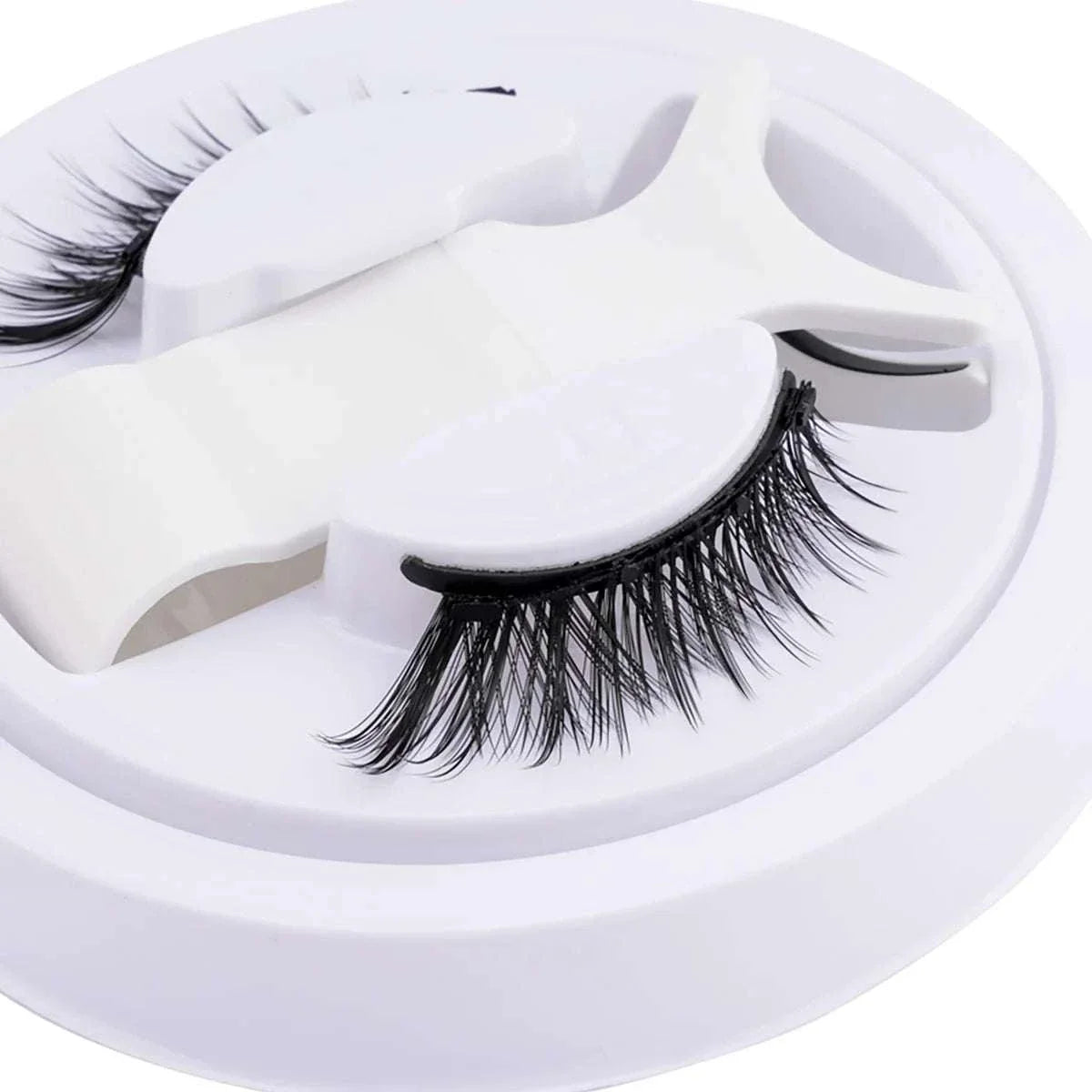 Hot magnetic eyelashes set with reusable, natural-looking lashes and included magnetic tweezers in a compact case.
