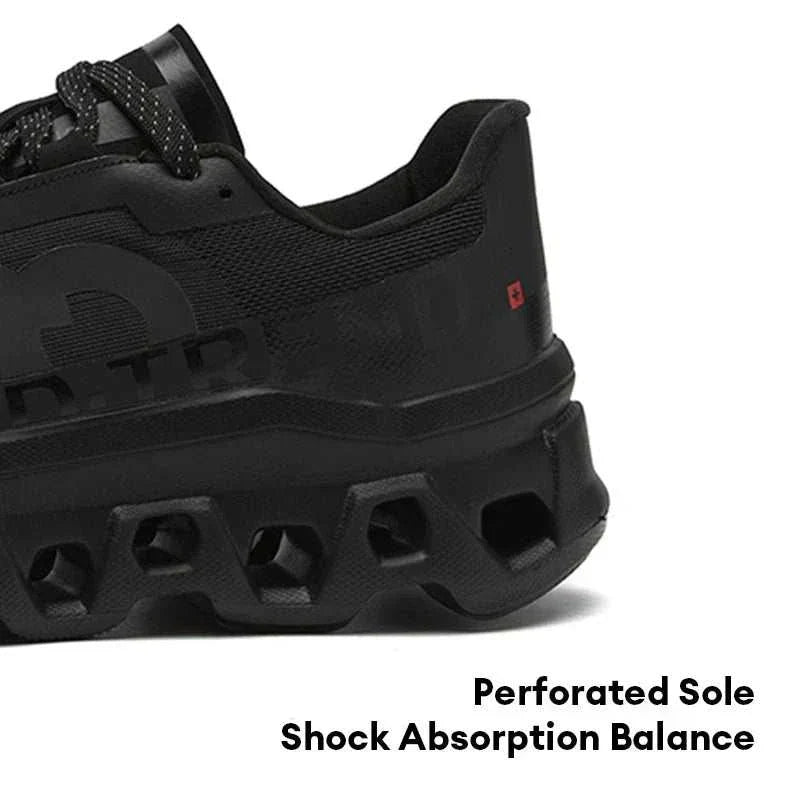 Black men's running shoe with perforated sole and shock absorption features for balanced performance