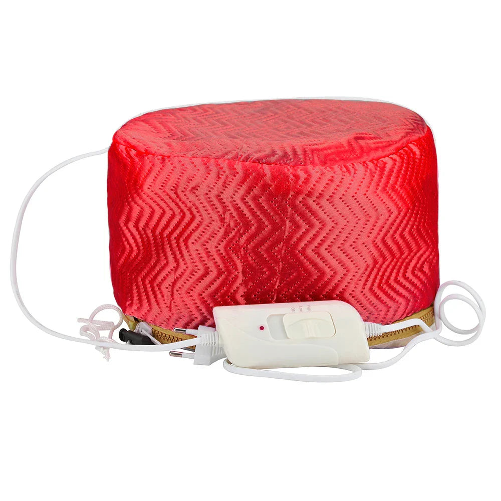 Red electric hair steamer cap with adjustable temperature control and waterproof lining for deep conditioning and hair treatment.