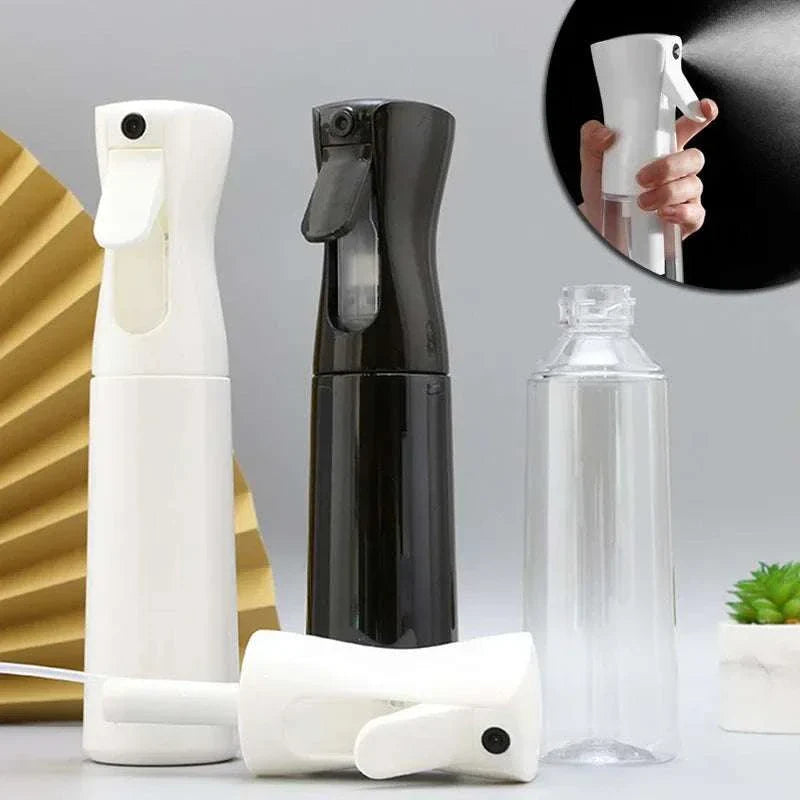 Set of high pressure mist spray bottles in white, black, and clear, designed for continuous fine mist spraying with ergonomic triggers.