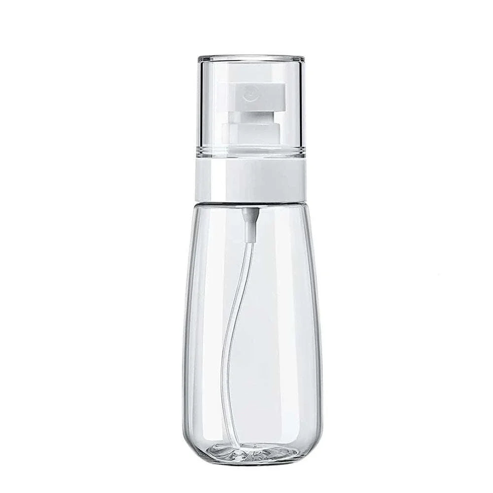 Clear 30ml mini travel spray bottle with fine mist nozzle and refillable design for hair, face, sanitizer, and plants.