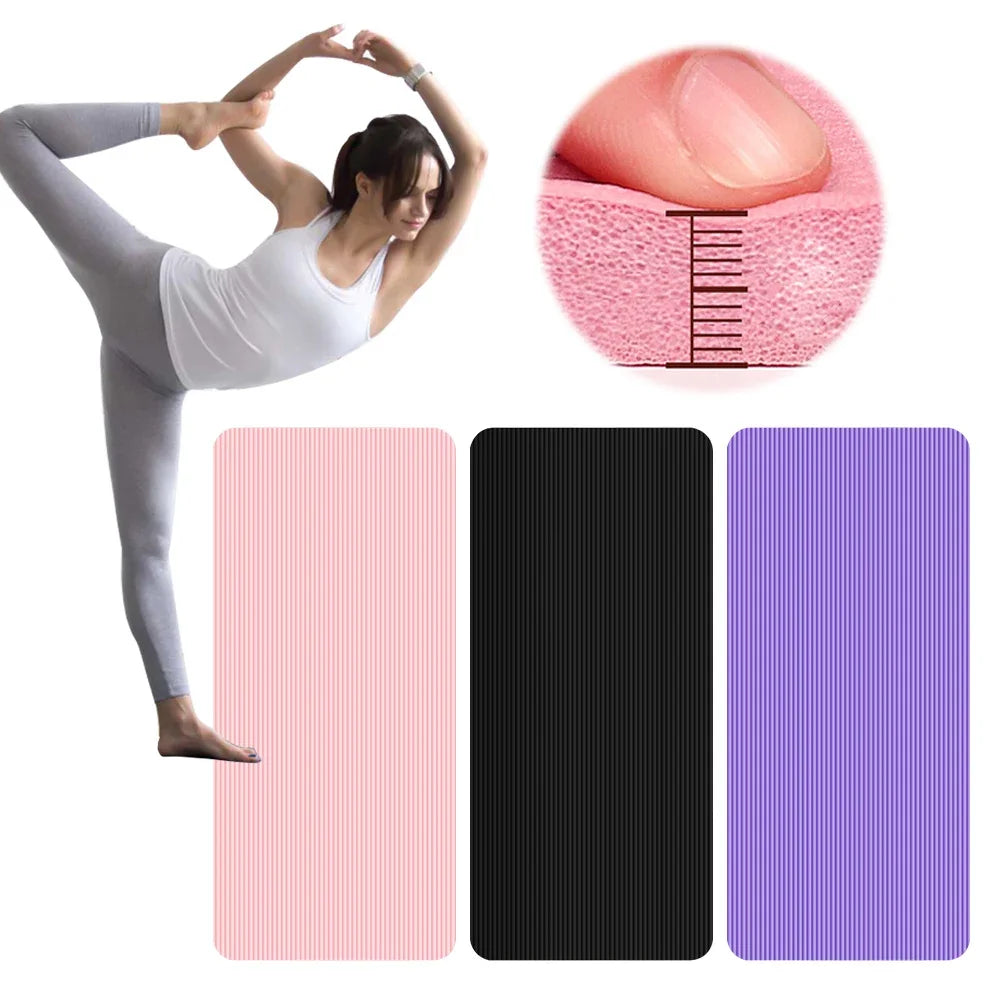 Non-slip yoga mat with thick cushioning and textured surface in pink, black, and purple colors for yoga and workouts