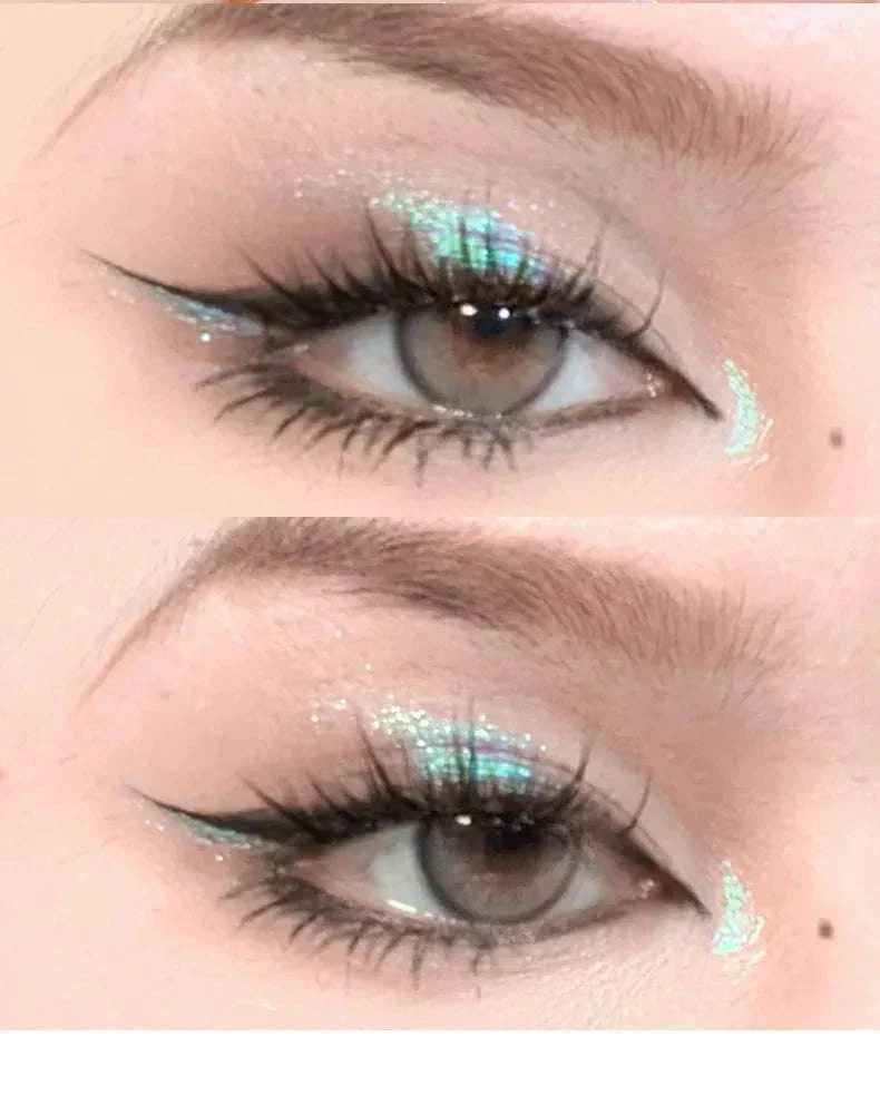 Close-up of eyes featuring shimmering diamond glitter monochrome eyeshadow with winged eyeliner and sparkling sequin accents.