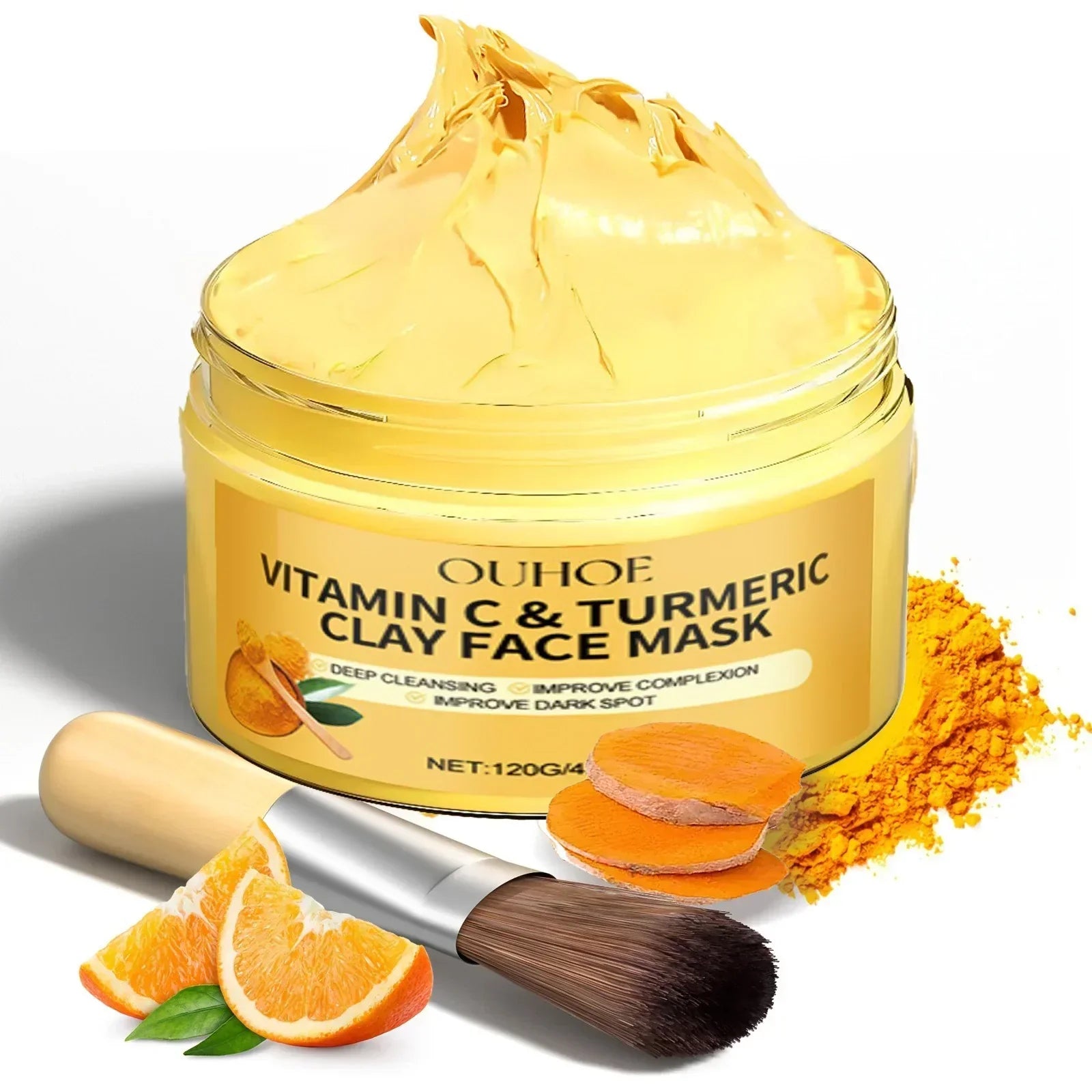 Vitamin C and turmeric exfoliating facial mask in jar with brush, orange slices, and turmeric powder for deep cleansing and brightening skin
