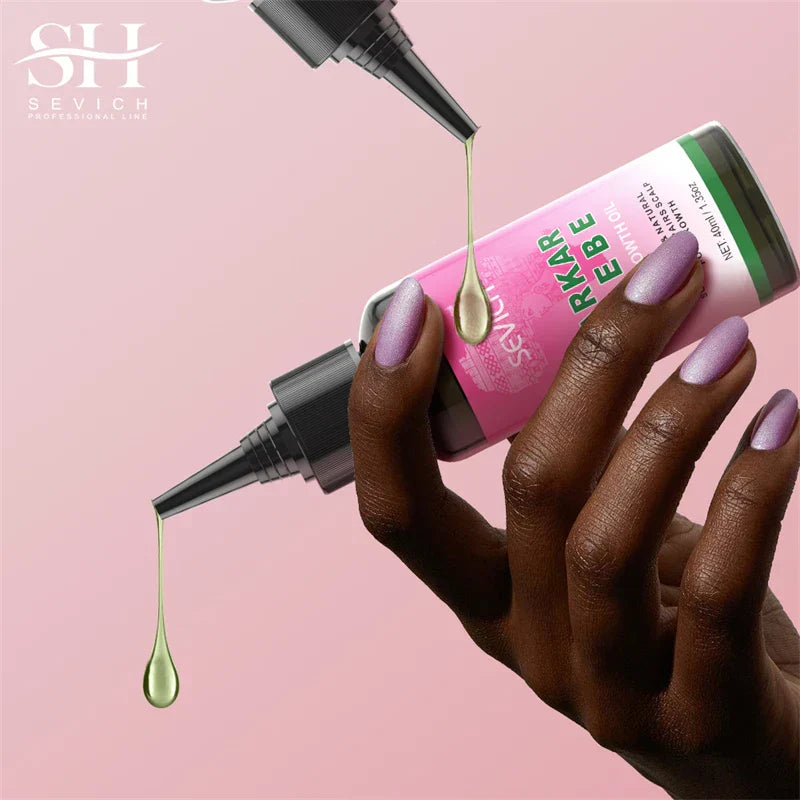 Chebe Fast Hair Growth oil bottle with dropper and dark-skinned hand on pink background